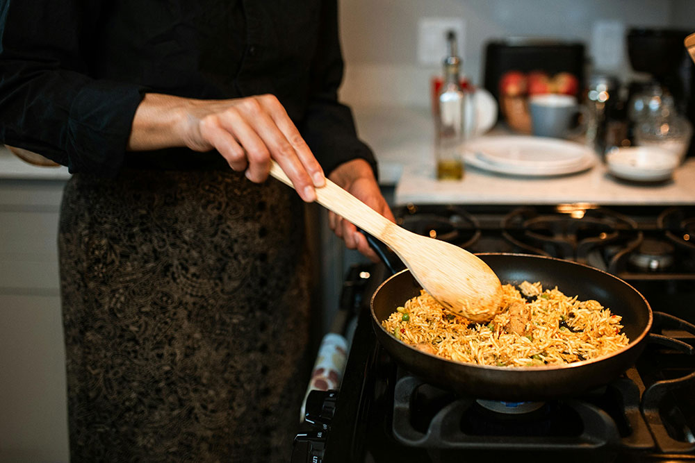 woman cooking cultural foods