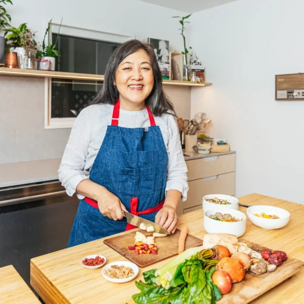 woman chopping veggies for article on menopause and diabetes