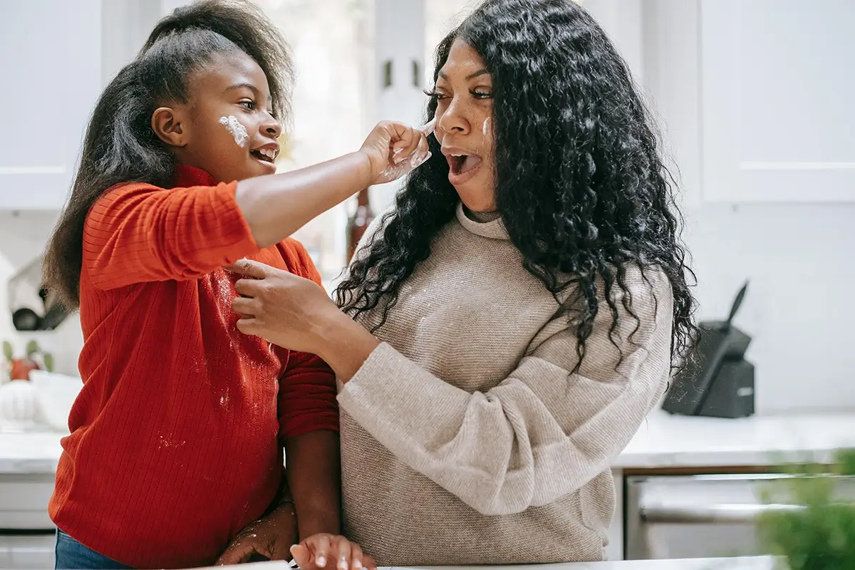 woman and child in kitchen baking