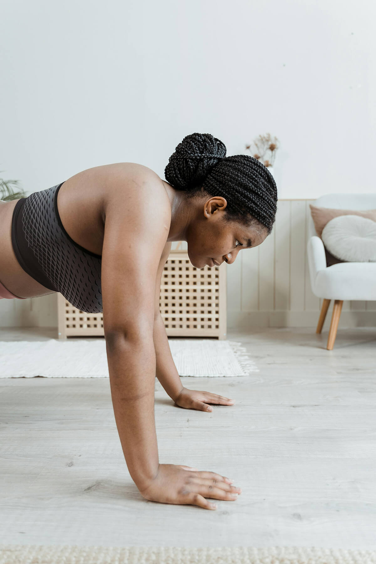 woman doing push-ups as part of holistic diabetes care plan