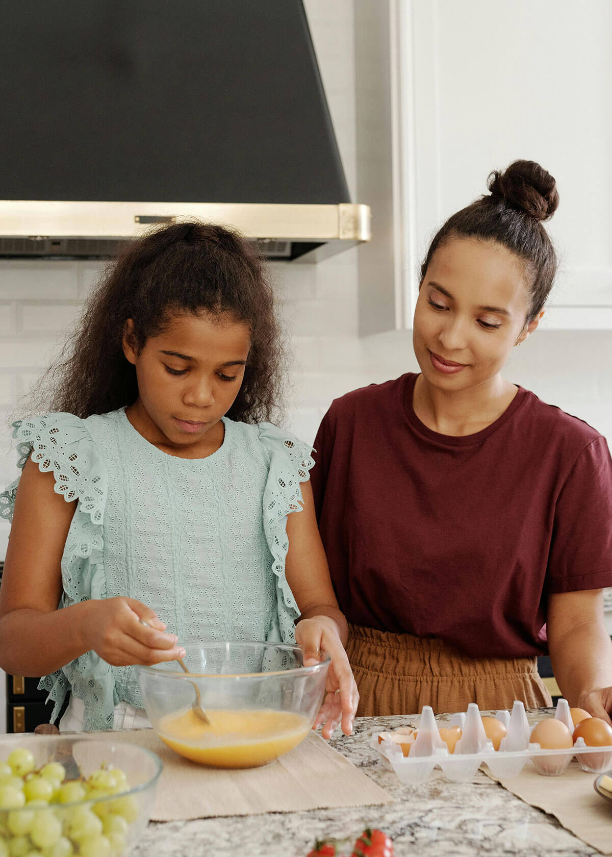 Mom and daughter baking for article on ARFID eating disorder.