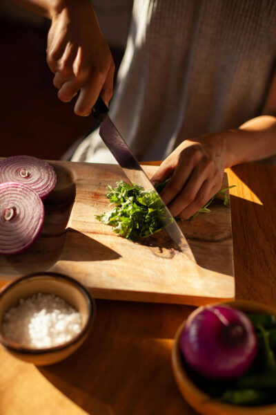 PPerson chopping herbs for holiday food