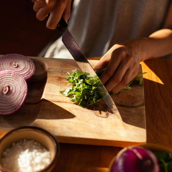PPerson chopping herbs for holiday food