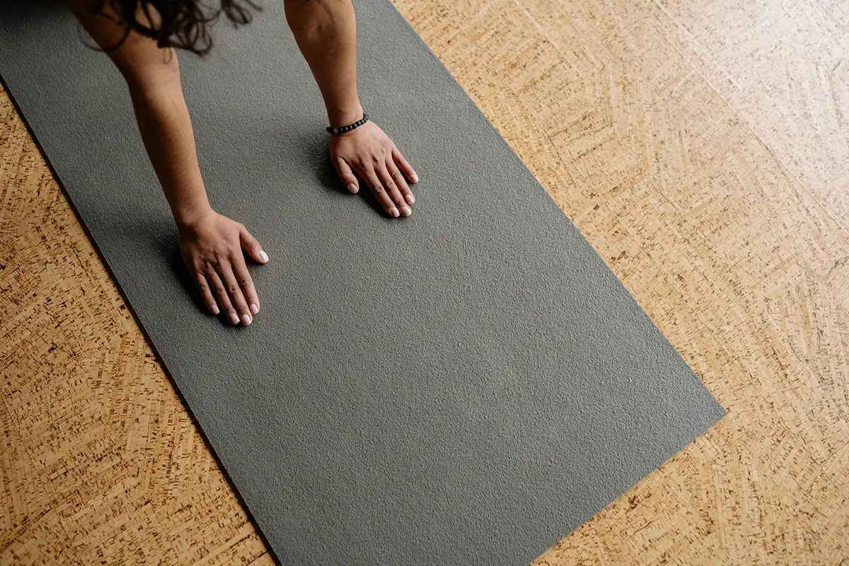woman gently stretching before bedtime to support blood sugar and sleep